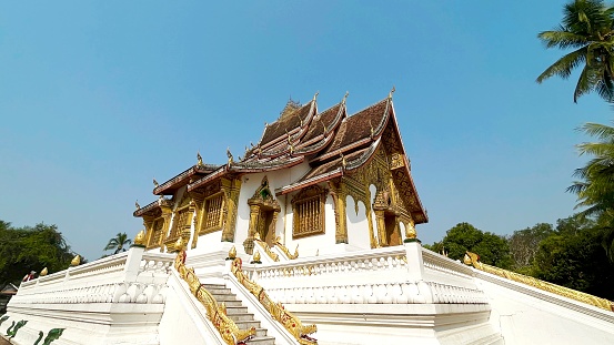 Luang Prabang, Laos.　\nThe entire ancient city of Luang Prabang is a World Heritage Site.　\nThe palace was built in 1904 until 1975, when the monarchy was abolished in Laos.\nThe palace serves as both a national museum and a royal palace for people to visit.\nLocated in the center of Luang Prabang, between the Puxi Hill and the Mekong River, the palace is a grand and luxurious palace. Many national cultural relics can also be seen here. The whole palace resplendent, dazzling, elegant decoration inside the palace.