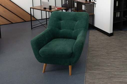 stylish office interior with an emerald soft chair in the foreground.