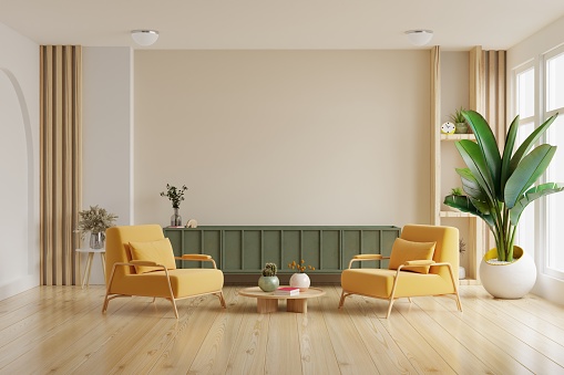 Mockup a TV wall mounted on green cabinet with yellow armchair in living room with a white wall.3d rendering