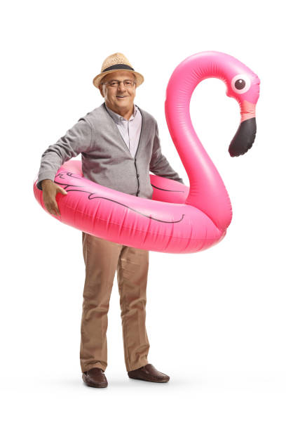 istock Elderly man with a big inflatable flamingo rubber ring 1479884204