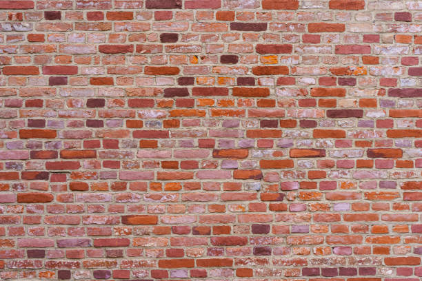 istock Old brick wall. Brickwork from an old brick in a rustic style. The structure and pattern of the destroyed stone wall. Copy space 1479885800