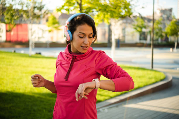 istock Portrait of a girl using smartwatch while running 1479887381