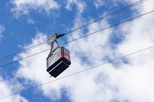 Jasper,Alberta,Canada - June 25 2022 : The Jasper Tramway is an aerial tramway in Jasper National Park. A cabin is just passing on his way during a 7 minutes trip to the Upper Station, located at an altitude of 2277M.