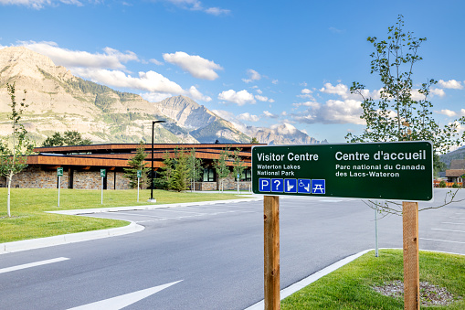 Waterton, Alberta, Canada - July 26, 2022: Sign for the Waterton Lakes National Park Visitor Centre in the downtown area