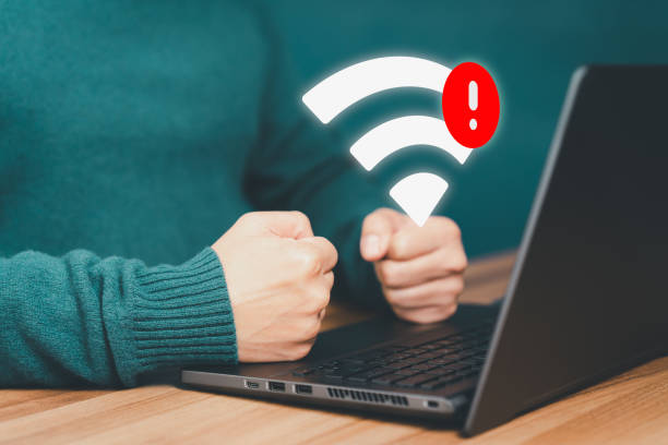 istock Man using a computer laptop to connect to wifi but wifi not connected, and waiting to loading digital business data form website, concept technology of waiting for connect to wifi. 1479894896