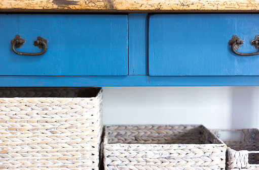 Home Decor with Blue Drawers and White Wicker Baskets