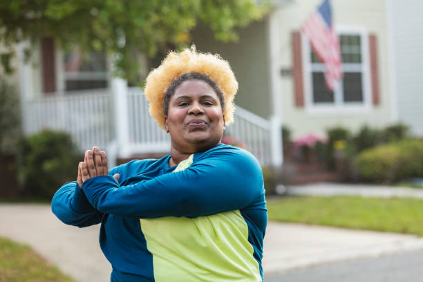istock African-American woman exercising, stretching 1479895454