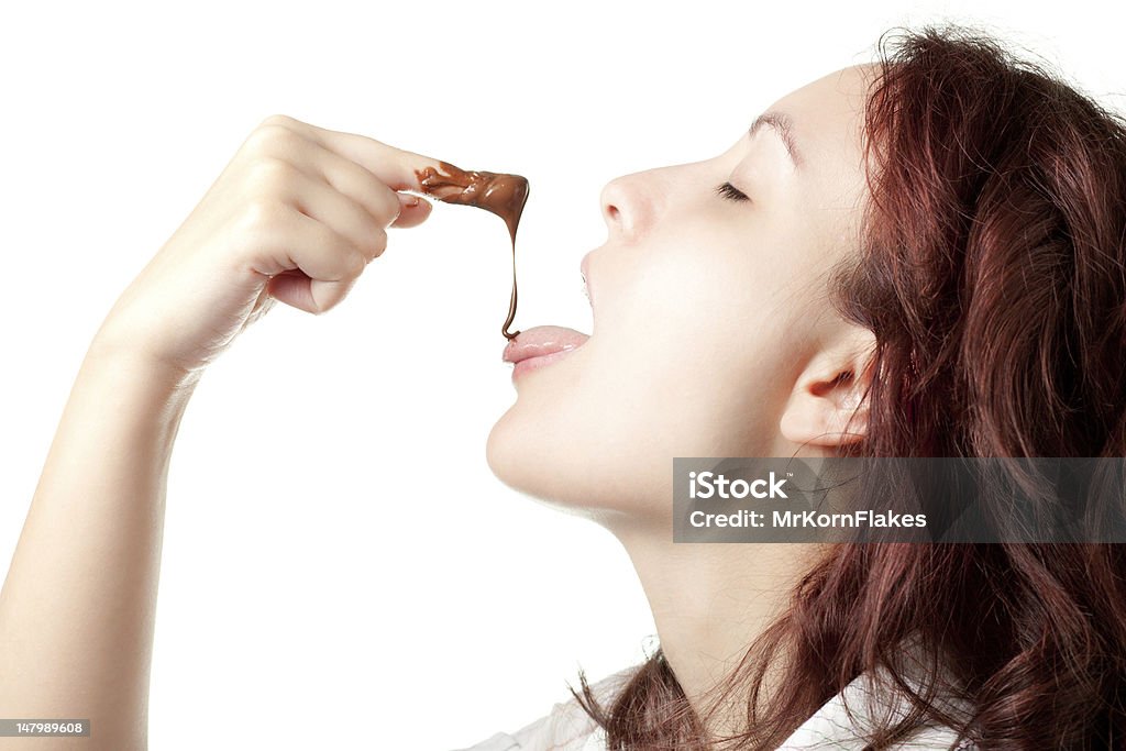 Donna degustazione Crema di cioccolato - Foto stock royalty-free di Cioccolato