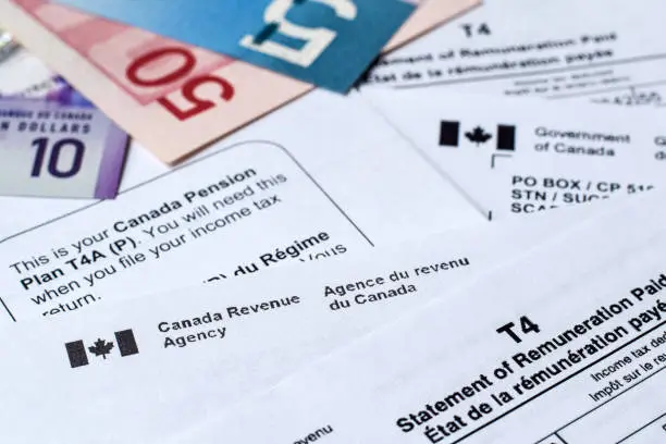 Photo of Canada Revenue Agency income tax forms and statements