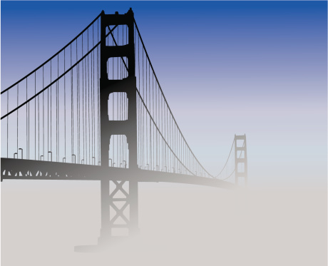 Silhouette of the Golden Gate Bridge covered in fog.