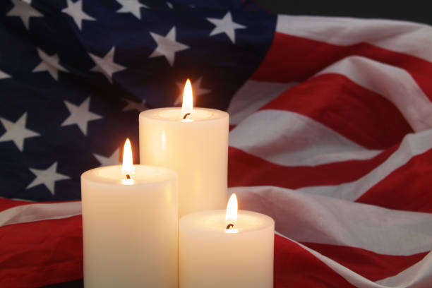 istock Burning candles on USA flag background. 1479899298