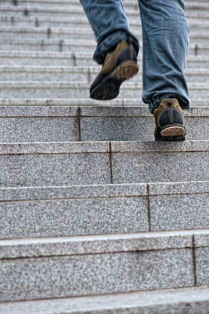 istock Man walking up the stairs 147990114