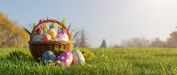istock A wicker basket with colorful Easter eggs on a beautiful green meadow with blue sky. 1479907610