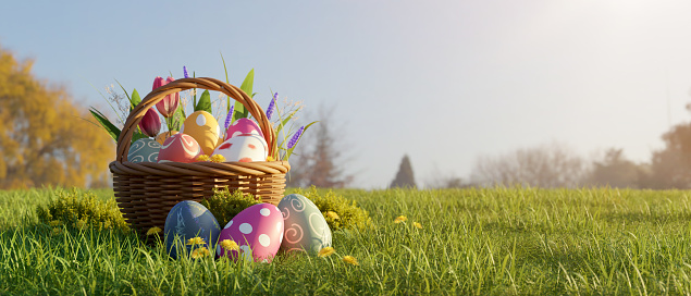 Hand painted easter eggs on green grass background