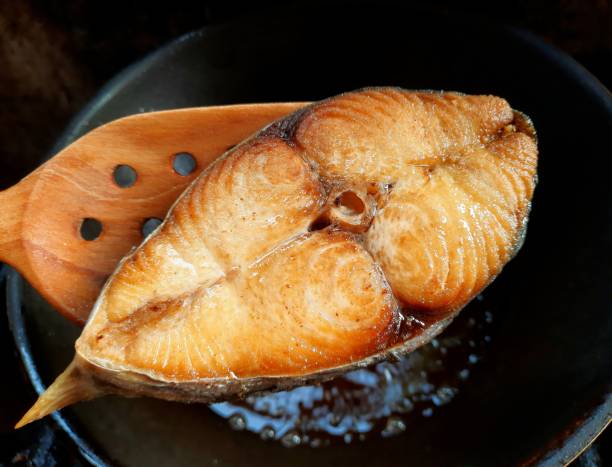 Cooking Deep Fried King Mackerel Fish - food preparation.