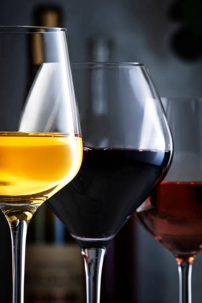 istock Wine glasses ans bottles assortment. Red, white, rose wines on gray table background. Wine bar, shop, tasting concept. Close-up 1479912030