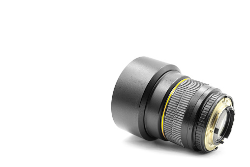 fast portrait lens 85 mm for a camera with a lens hood on a white background close-up with empty space for text
