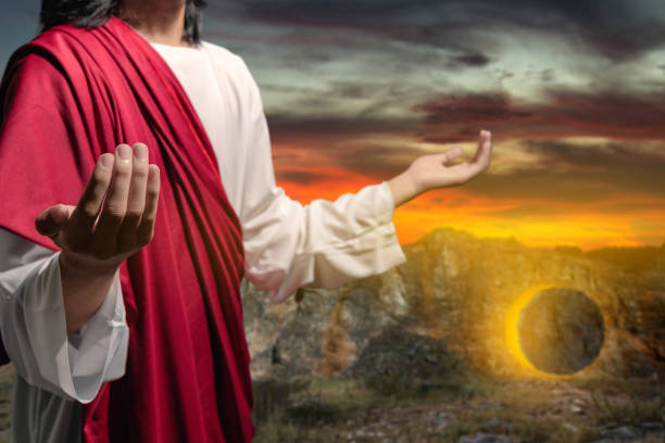 istock Jesus Christ's raised hands and praying to god 1479914879