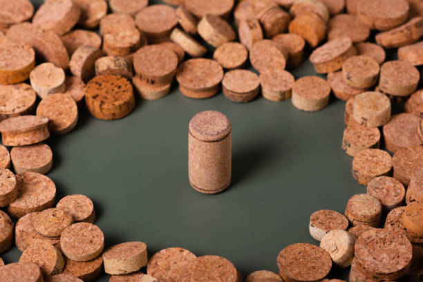 Recycling symbol and wine cork for secondary use. Preservation of the ecology of the planet. Raw materials for reuse. Environmental Protection.