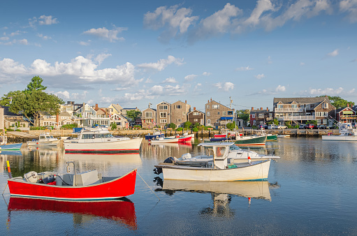 Boats at anchor in the harbor at Rockport, a small coastal town in the U.S. state of Massachusetts. Rockport is located about 40 miles (64 km) northeast of Boston at the tip of the Cape Ann peninsula in Essex County.