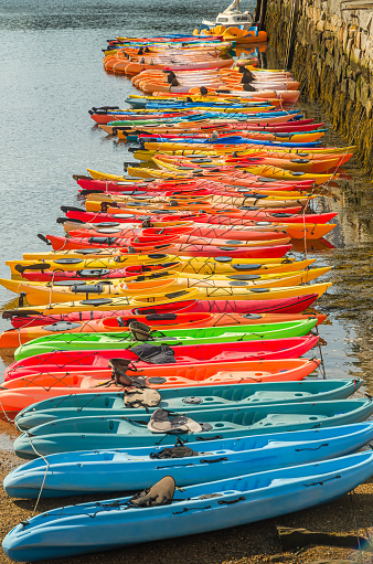 Colorful kayaks are moored at the wharf at Rockport