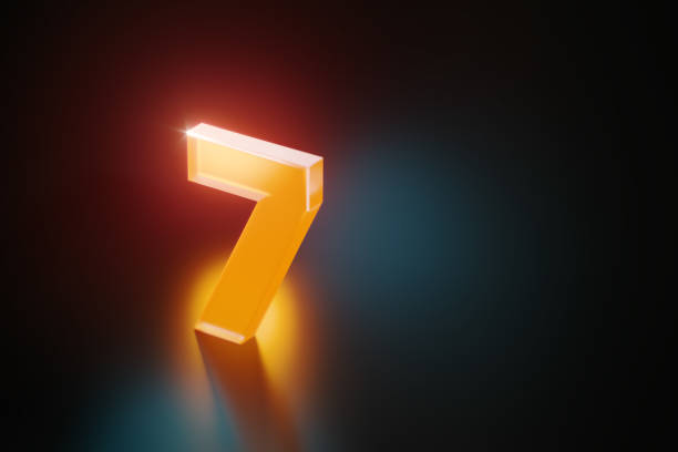 Orange number seven glowing on black background. Horizontal composition with copy space.