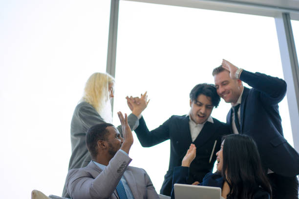 istock White collar workers are talking and celebrating at office. 1479926243