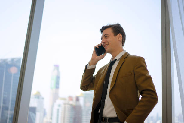 istock Business man talking with smart phone. Cityscape. 1479926309