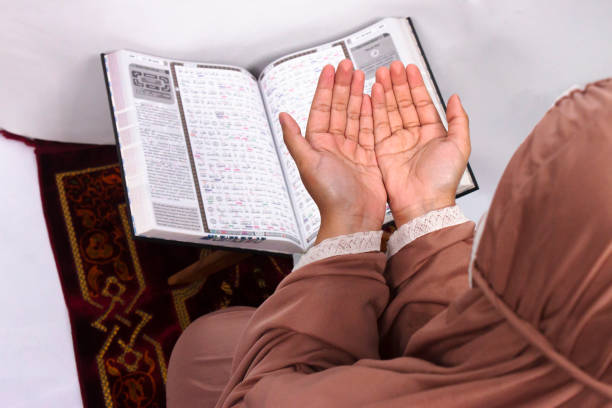 istock Islamic woman reading holy quran 1479927309