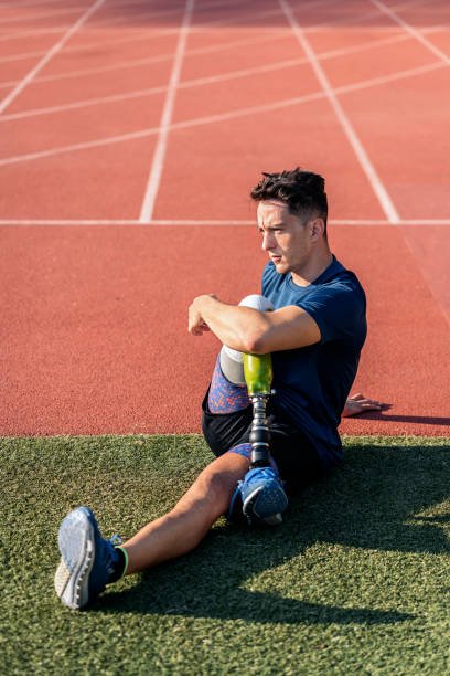istock Disabled man athlete stretching with leg prosthesis 1479929133