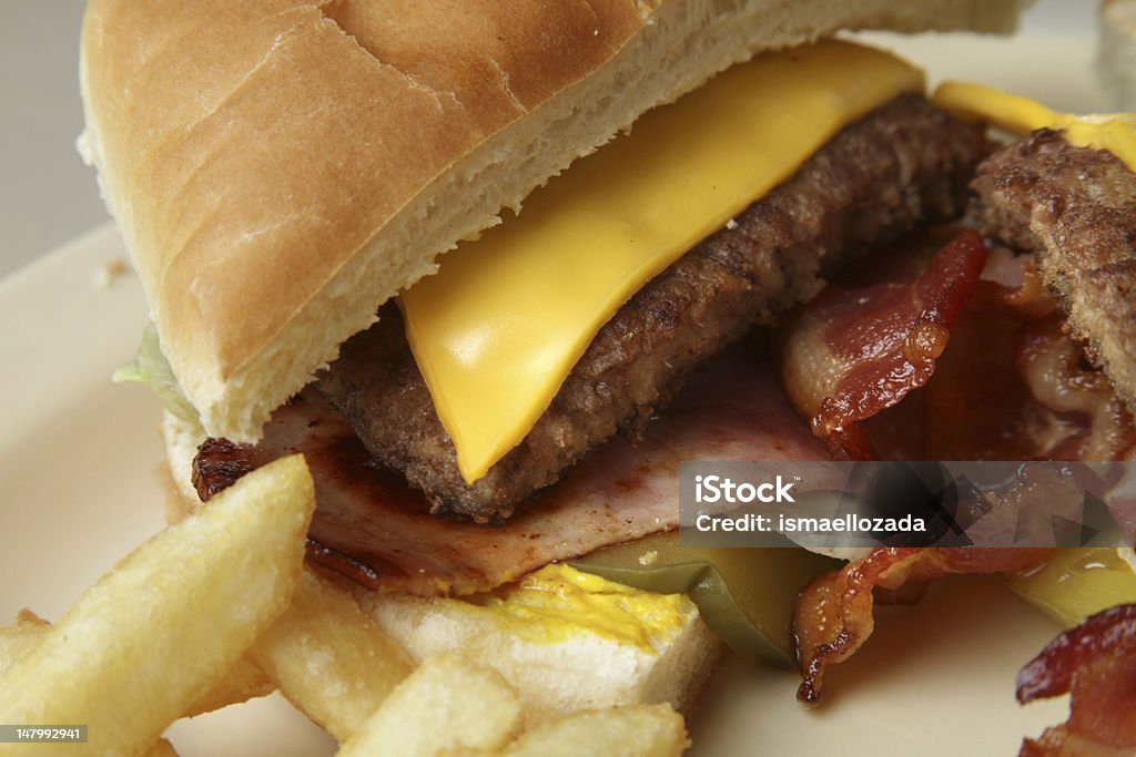 Cheese Burger Cheese burger served with french fries. Bacon Stock Photo