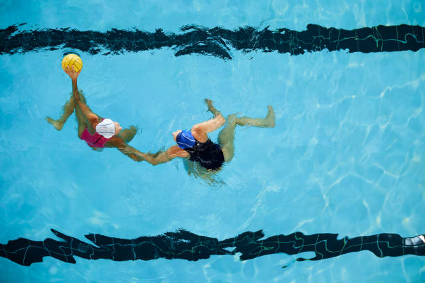istock Two professional female water polo players facing off. 1479933335