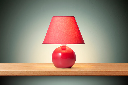Red lamp on the shelf.