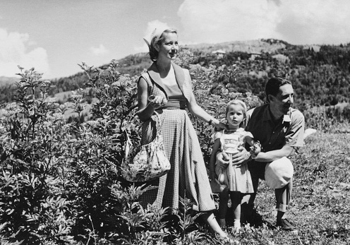 Happy family on vacation in mountain, 1952. Summer Holidays on European Alps.
