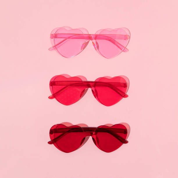 istock Valentines day creative pattern with heart shaped sunglasses on pastel pink background. 80s or 90s retro fashion aesthetic love concept. Minimal romantic cosmetic idea. 1479935862