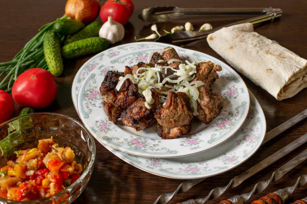 istock pork skewers with onions, in a large plate 1479937163