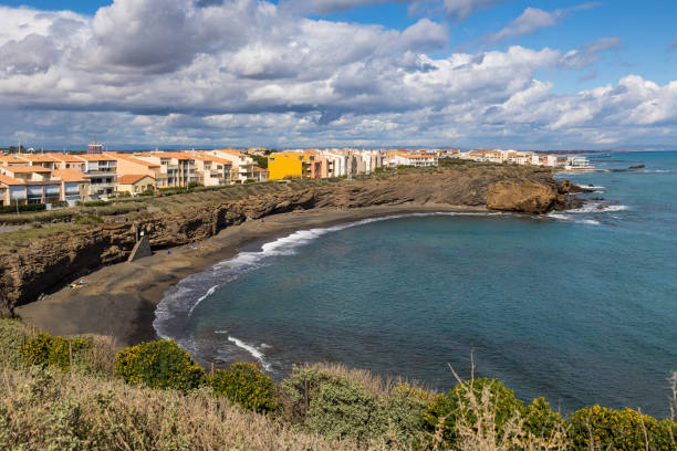 istock Grande-Conque beach in basalt rock on a cloudy day in Cap d'Agde 1479944933