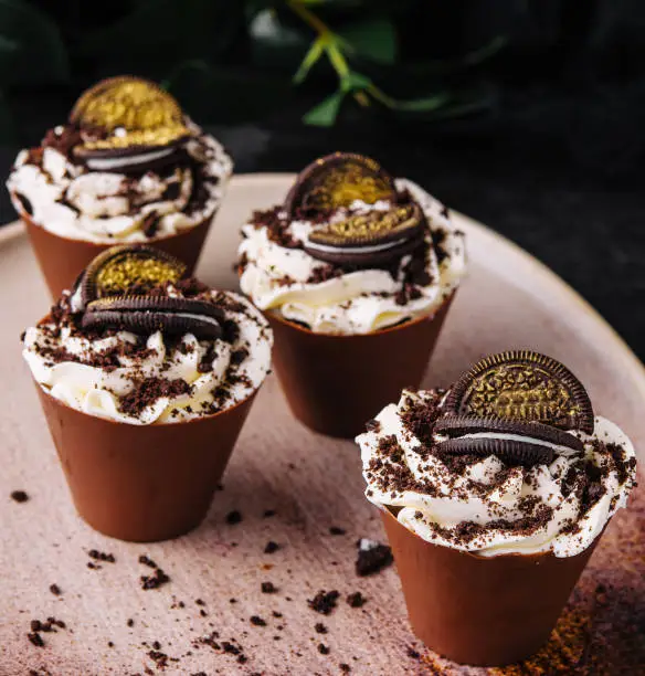 Photo of Tiramisu with chocolate cookie cookies on plate