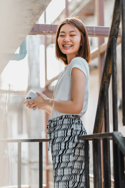 istock A Chinese young lady with braces smiling to camera 1479950364