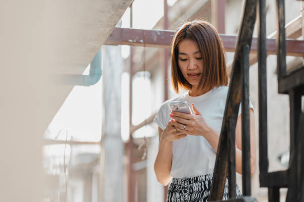 istock A young Asian Chinese lady using smartphone 1479950368