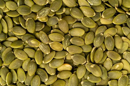 Roasted pumpkin seeds background