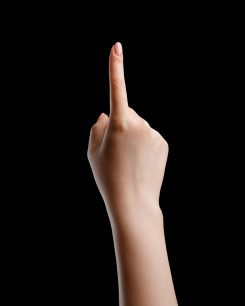istock Click with the index finger of a female hand on a black background, isolate. 1479959992