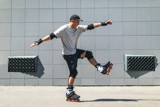 istock Young adult man roller skating outdoors and doing tricks 1479960865