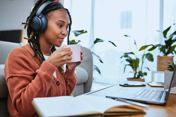 istock Elearning, studying and woman with laptop and coffee for education, university work and virtual course. Email, happy and online student with tea reading feedback on a project on a computer in a house 1479969400