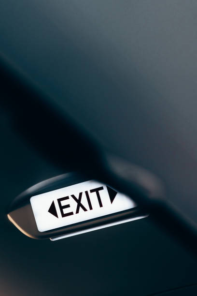 istock Close up of exit sign in passenger airplane. 1479972157