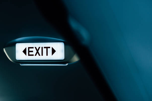 Close up of exit sign in passenger airplane.