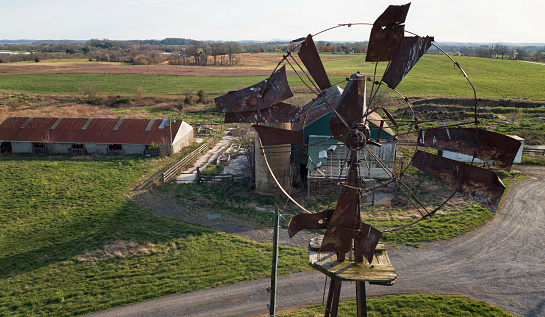 Broken windmill on a deserted farm.