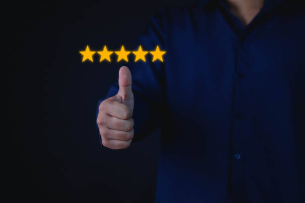 istock businessman hand drawing 5 yellow stars 1479978628