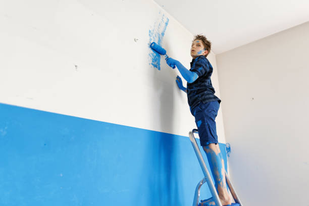 istock Teenage boy making mistake while painting the room 1479979243