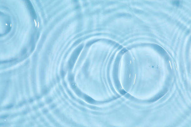 istock Blue water texture, blue water surface with rings and ripples. Spa concept background. Flat lay 1479979662
